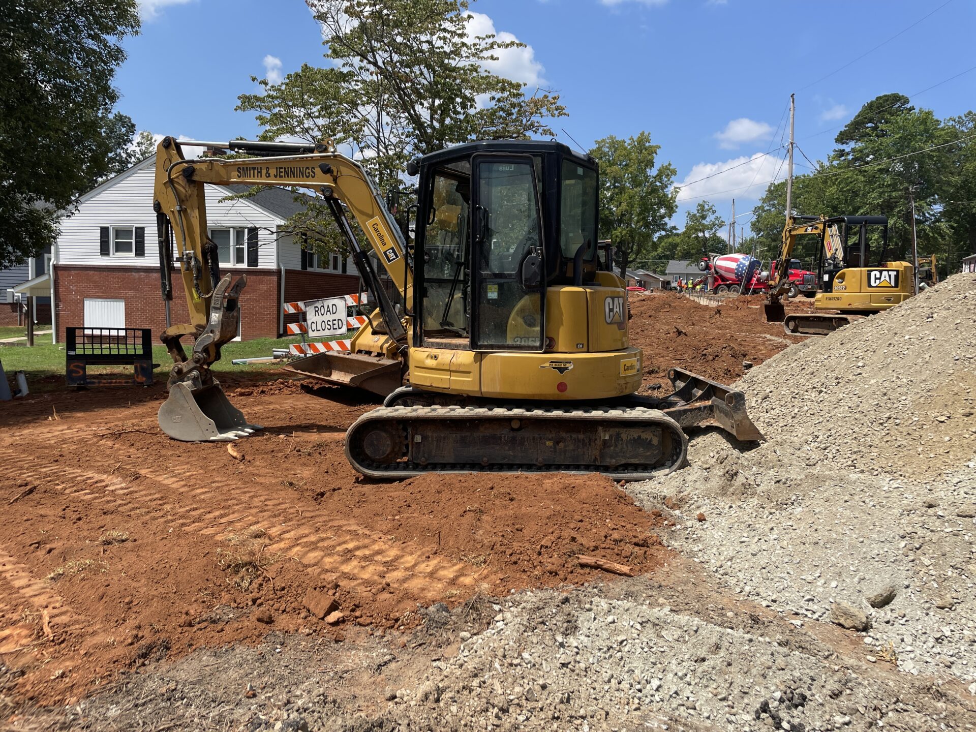 A yellow and black tractor is parked on the ground