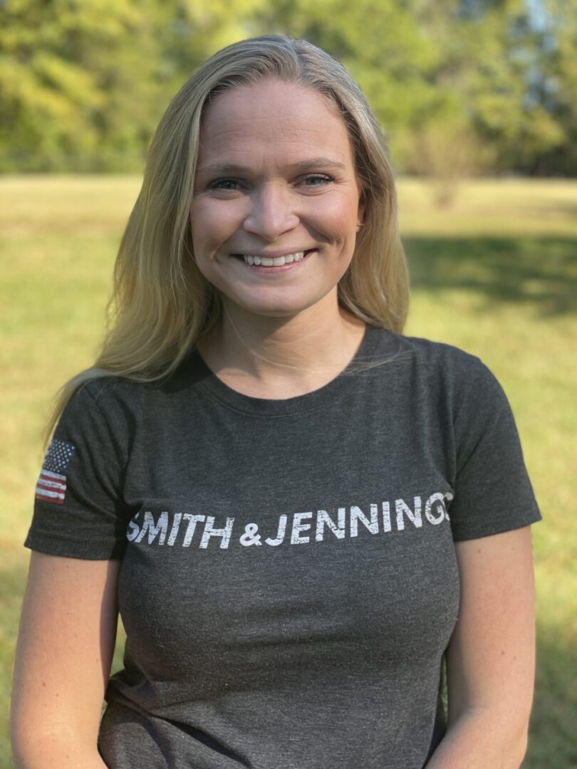 A woman wearing a t-shirt that says smith & jennings.